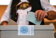 Michael V. Owens on the Shaky State of Bavarian Politics A voter in traditional Bavarian attire casts his ballot at a polling station in Irschenberg ( EPA/PHILIPP GUELLAND )