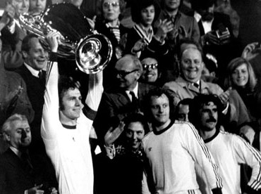 Franz Beckenbauer hoists the Cup