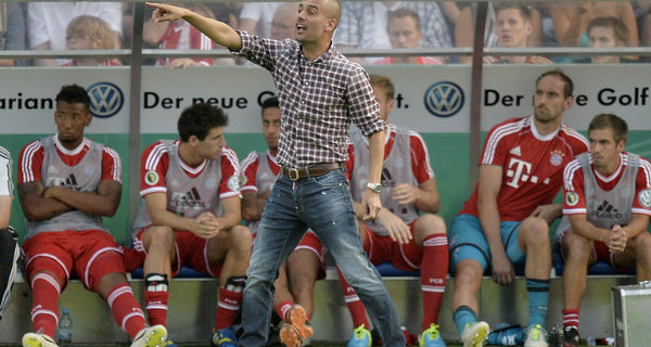 Guardiola pointing the way. Not sure about those shoes though... Photo: DPA
