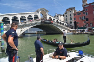  Italian police officers patrol Venice's Grand Canal after a German tourist was killed and his three-year-old daughter seriously injured when a gondola, carrying them on Venice's Grand Canal, collided with a ferry on 17 August 2013. The man appeared to have been crushed between the two boats near the historic city's famous Rialto Bridge, a spokesman for Venice's fire brigade said. The little girl suffered a head injury and was taken to a hospital in Padua for treatment. EPA/ANDREA MEROLA