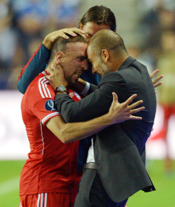 Franck Ribery celebrates his goal with manager Pep Guardiola. Photo: DPA