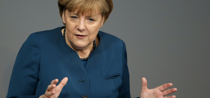 German Chancellor Angela Merkel gestures during a government statement about Europe at the German federal parliament, Bundestag, in Berlin, Germany, Wednesday, Dec. 18, 2013. (AP Photo/Michael Sohn)